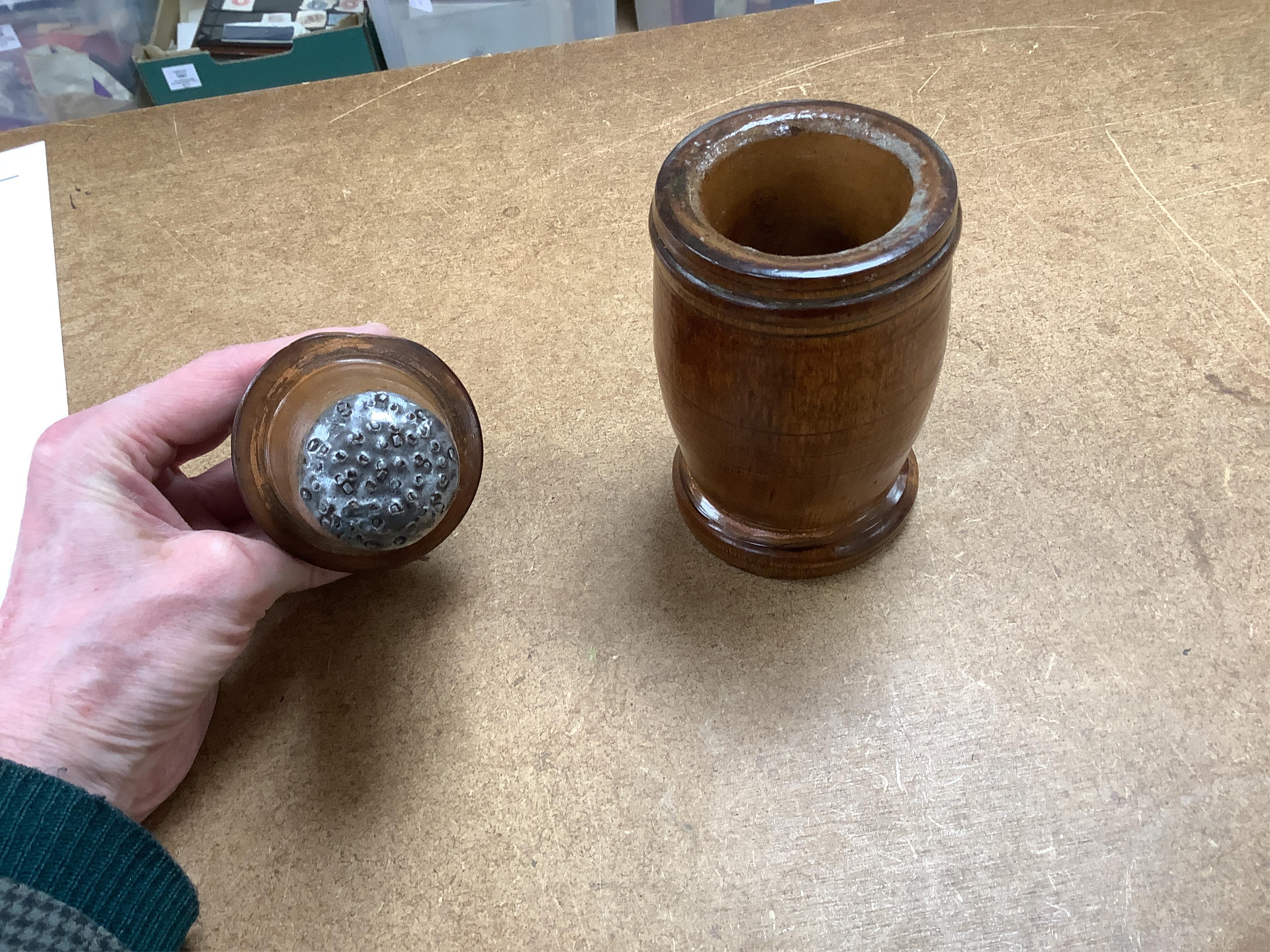 Sundry items to include a large pestle, spice grinder, flat iron on stand, bronze mortar and three other items, largest 42cm in length